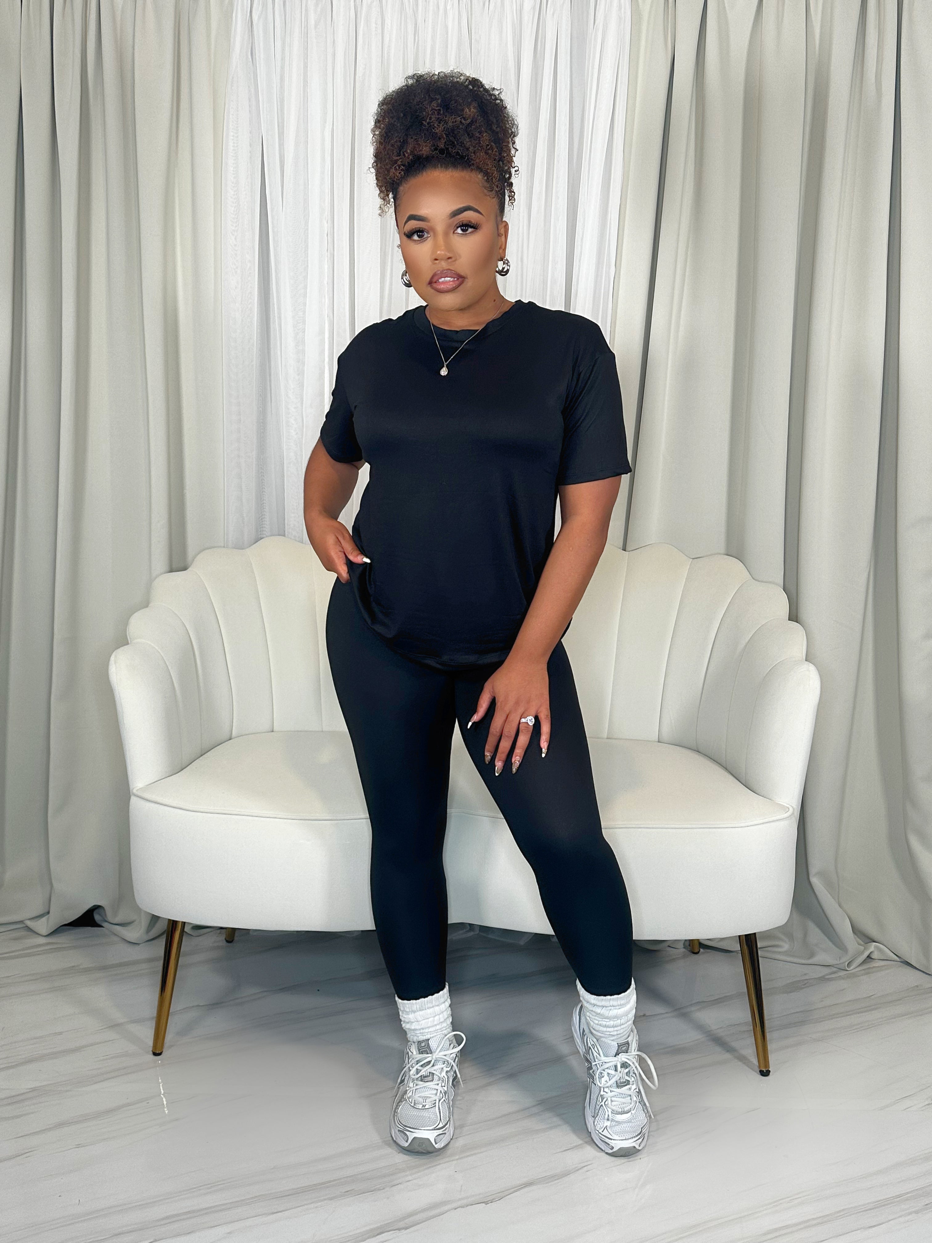 Woman wearing buttery soft two-piece legging set in black