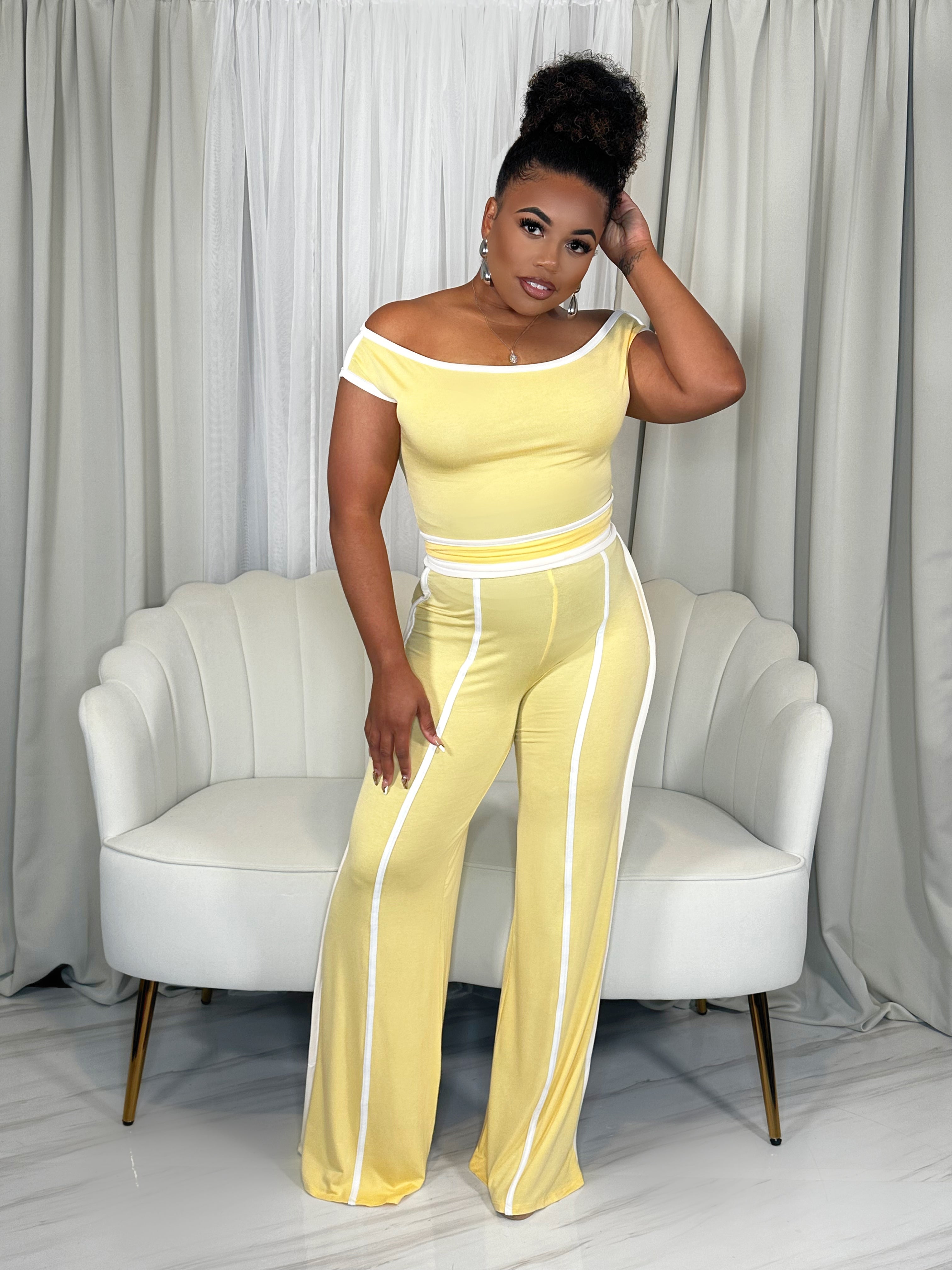 Black woman wearing yellow two-piece pant set from KASH Queen – stretchy, dressy casual outfit for brunch or travel